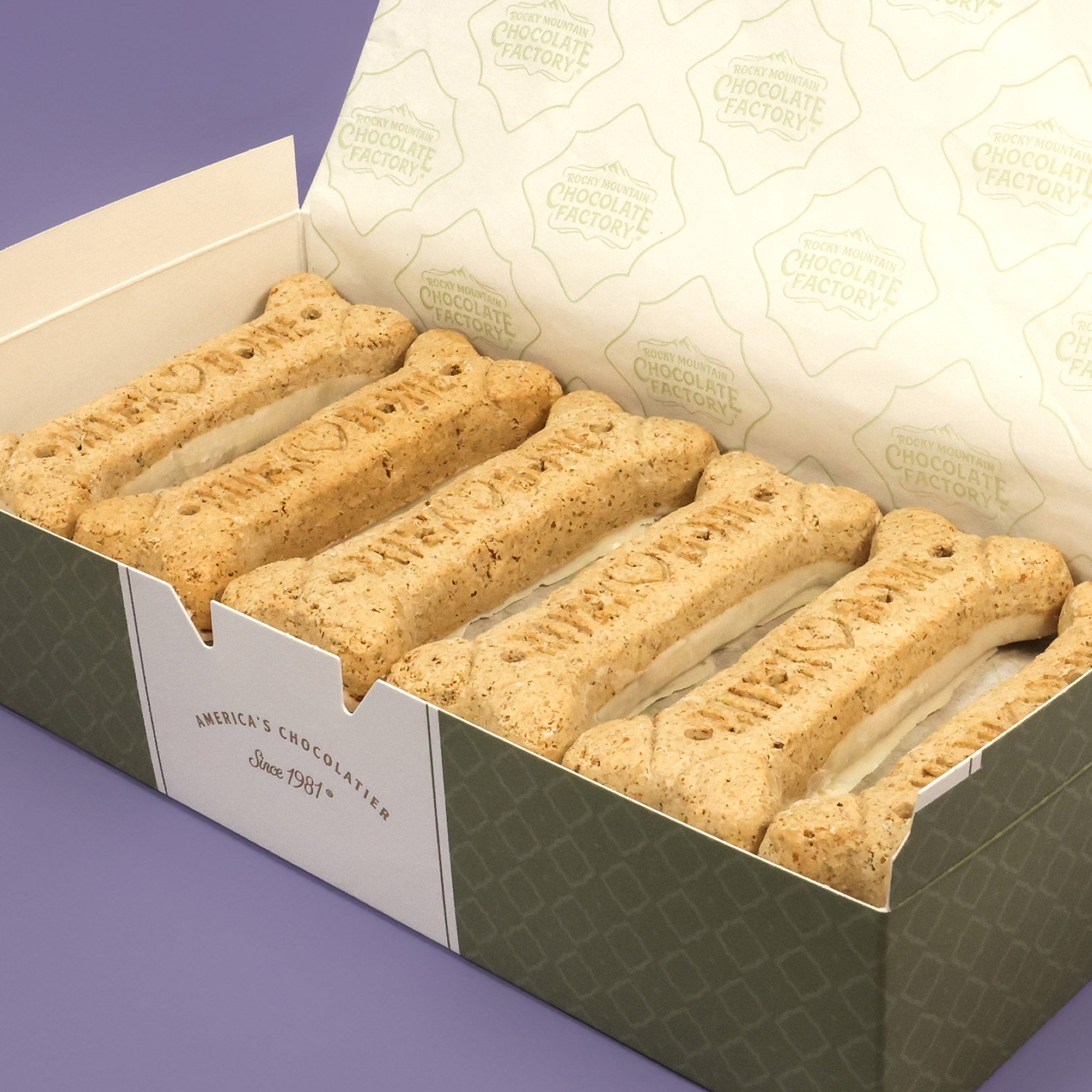 Barker’s Dozen,  12 large bone-shaped treats dipped in dog-safe white confection